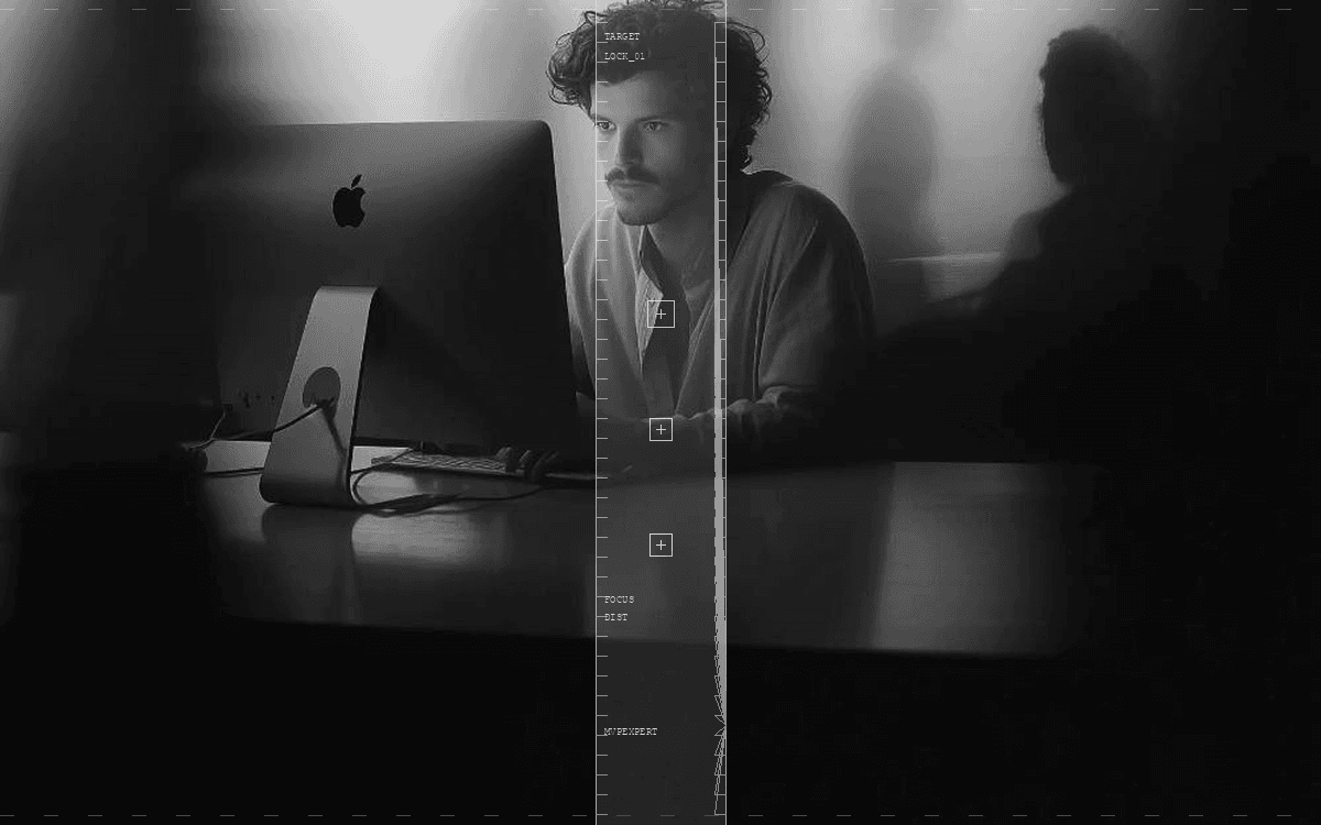 Monochrome founder at a desk in motion blur — with tech HUD overlay